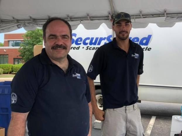 An employee at SecurShred